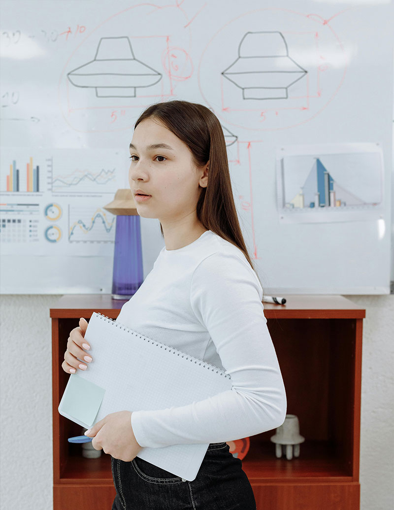 A whiteboard roll displayed on a classroom wall.